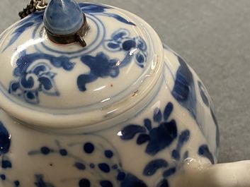 A Chinese blue and white tripod teapot with figures in a landscape, Kangxi